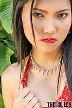  long black hair intense look playing with red dress